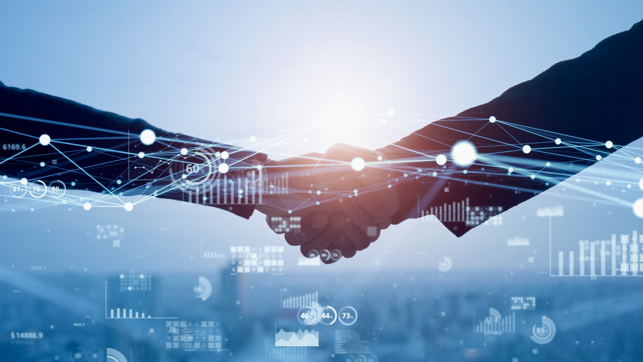 Apretón de manos con conexiones digitales que simboliza la colaboración entre modelos Venture Building y Venture Client en innovación corporativa.